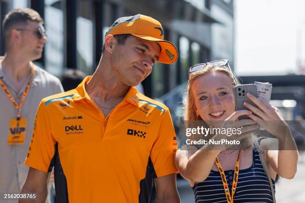 Lando Norris of Great Britain and McLaren F1 Team driver is arriving at the paddock before the practice session at the Formula 1 Hungarian Grand Prix...