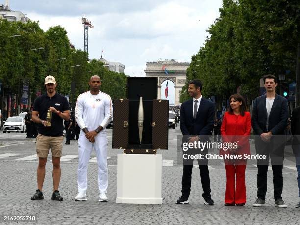 French football Olympics 2024 coach Thierry Henry poses for a photo with Paris 2024 Olympics and Paralympics Organizing Committee President Tony...
