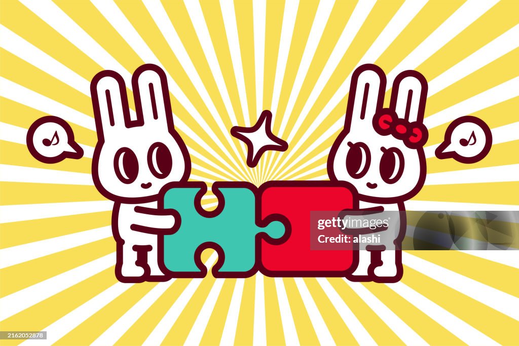 A cute bunny couple completes a jigsaw puzzle