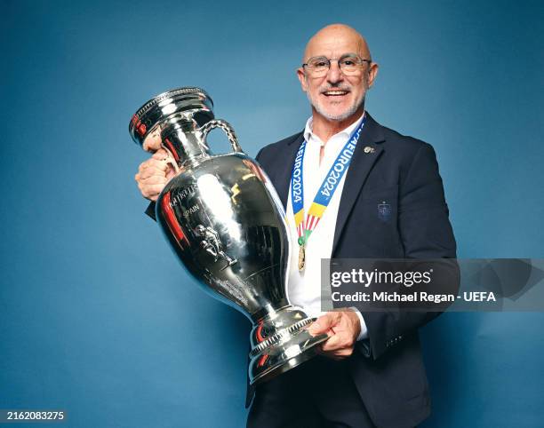 Luis de la Fuente, Head Coach of Spain, poses for a photo with the UEFA Euro 2024 Henri Delaunay Trophy during the UEFA EURO 2024 final match between...