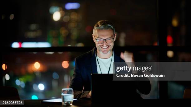 excited, night or businessman with laptop, success or victory for a deal, blog news or email. goal achievement, bonus or happy mature worker winning online for trading investment or financial profit - rewards program stock pictures, royalty-free photos & images