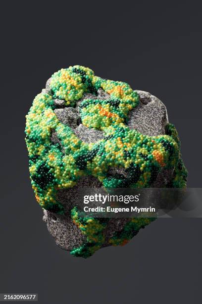 rock structure covered colorful spheres - information equipment stock pictures, royalty-free photos & images