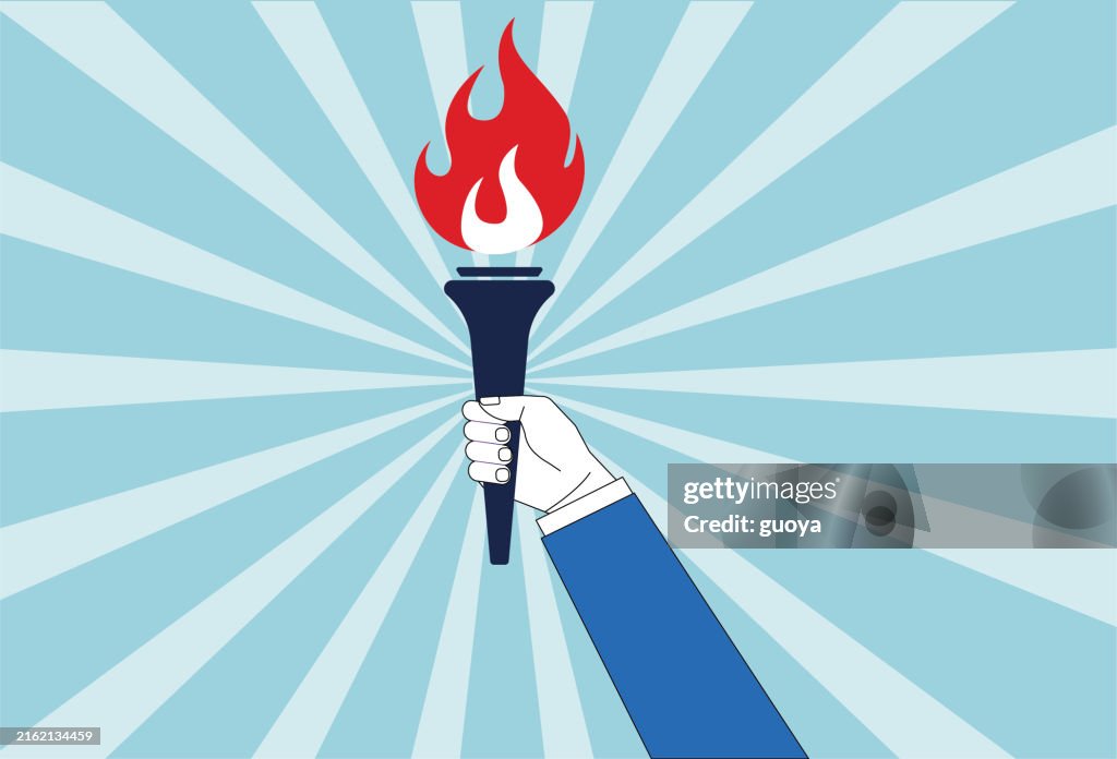 Holding a torch.