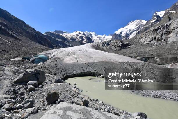 the snout of the morteratsch glacier during a heat wave - moraine stock pictures, royalty-free photos & images