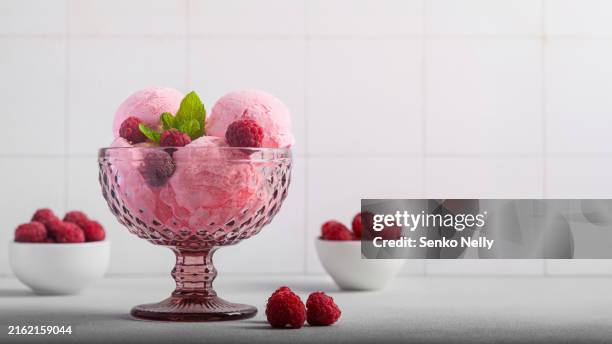 raspberry ice cream with mint and raspberries on a light background - sherbert stock pictures, royalty-free photos & images