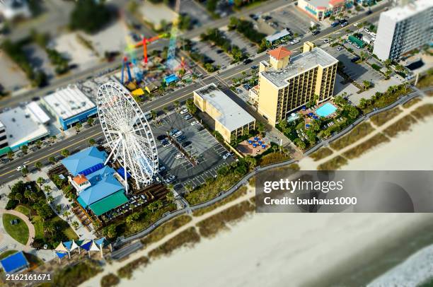 tilt shift, myrtle beach skywheel and boardwalk - myrtle beach amusement park stock pictures, royalty-free photos & images