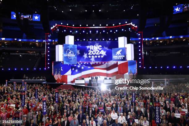 Speaker of the House Mike Johnson and Republican National Committee co-chair Michael Whatley appear on stage as the convention takes the official...