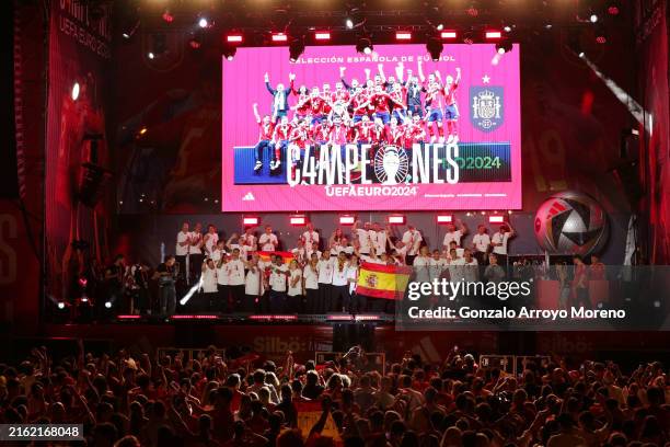 The Spain team celebrate with the fans during the Spain EURO 2024 Trophy Parade on July 15, 2024 in Madrid, Spain.