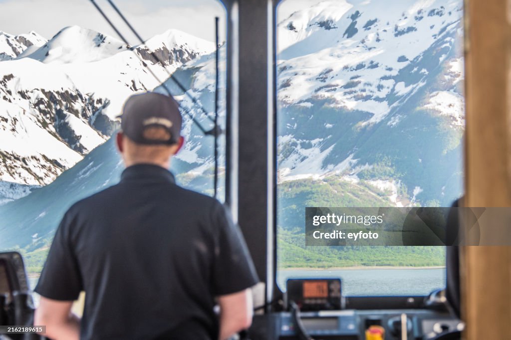 Tour boat navigating in Yakutat Bay Alaska
