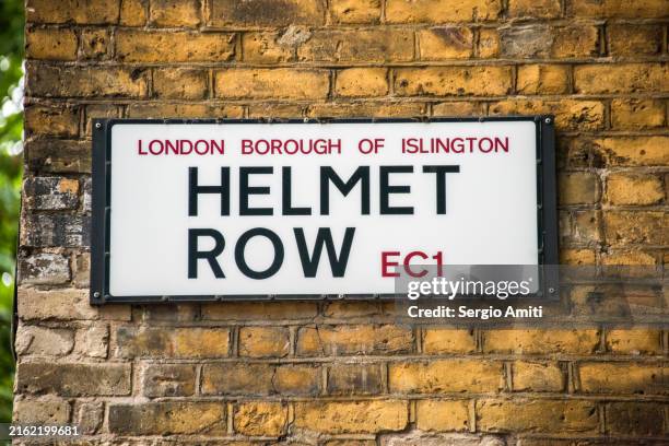 helmet row sign - islington stock pictures, royalty-free photos & images