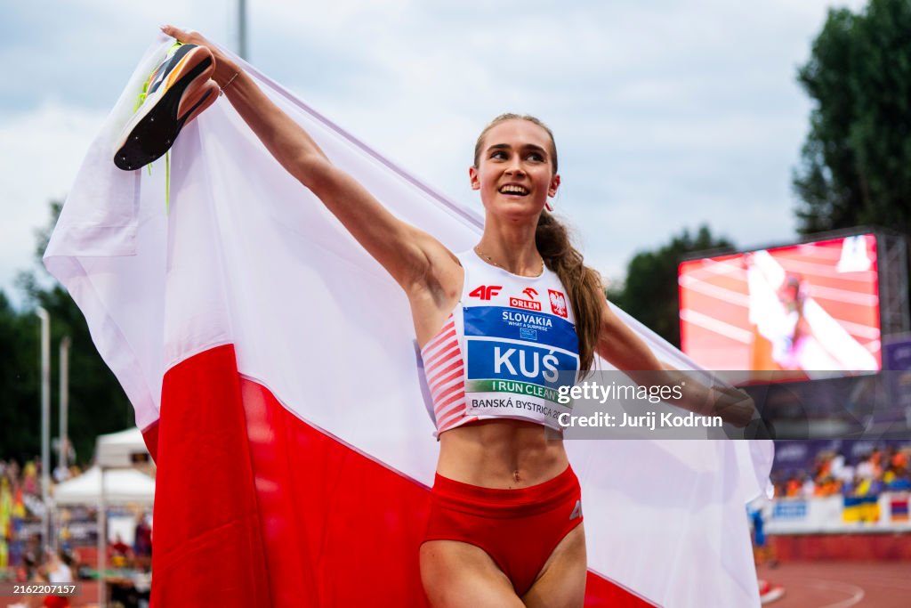 Polish Rinner Anastazja Kus of Poland poses with flag Women's 400m during day three ...