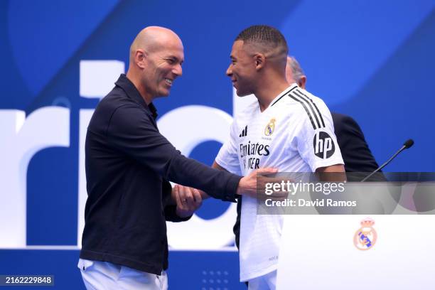Real Madrid new signing, Kylian Mbappe is greeted by former Real Madrid player and coach, Zinedine Zidane as he is unveiled at Estadio Santiago...