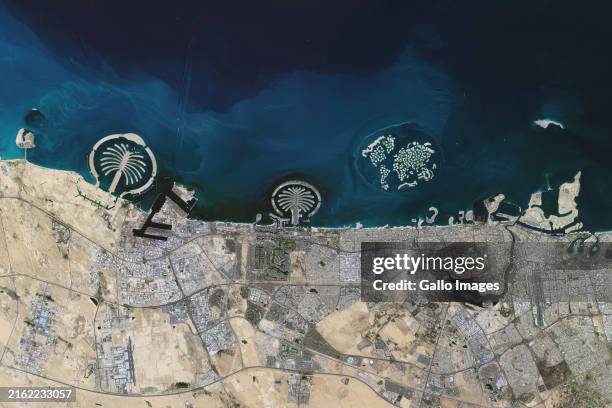 Satellite view of the Dubai coastline, UAE, featuring offshore developments, Palm Jebel Ali, Palm Jumeirah, The World Islands, and Palm Deira.