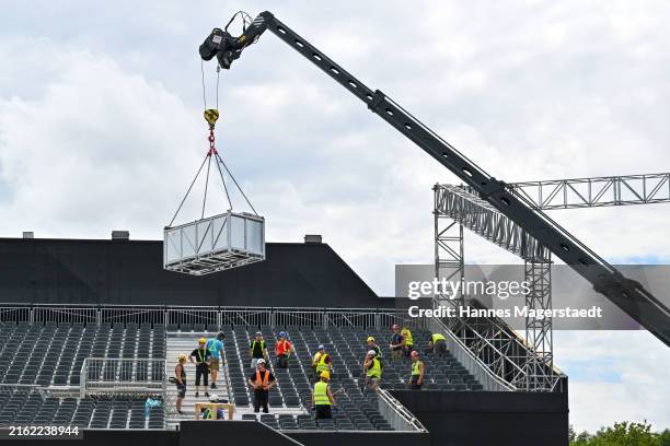 Workers build the stands for Adele's concerts at Messe München during the "ADELE WORLD" press conference prior to her Munich Concerts at Messe...
