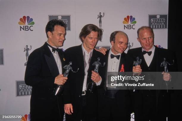Tom Hanks, Kevin Bacon, Clint Howard and Ed Harris holding their trophies at the 2nd Screen Actors Guild Awards, Santa Monica Civic Auditorium,...