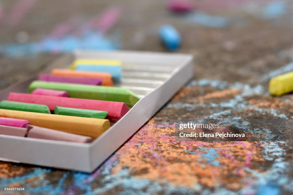 A box of chalks on the ground