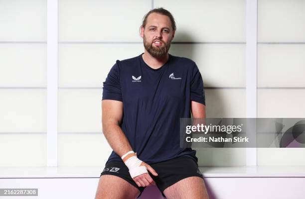 Matt Bush of Great Britain poses for a photograph during the Team GB Paris 2024 Olympic Games taekwondo squad media session at National Taekwondo...