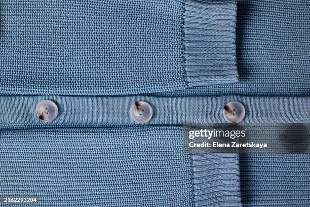 knitted sweater with buttons close-up - clothes buttons stock pictures, royalty-free photos & images