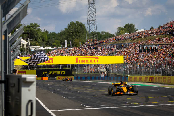 Oscar Piastri, McLaren MCL38, 1st position, takes the chequered flag during the F1 Grand Prix of Hungary at Hungaroring on July 21, 2024 in Budapest,...