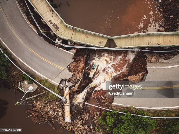road washout in fishing village - climate change canada stock pictures, royalty-free photos & images