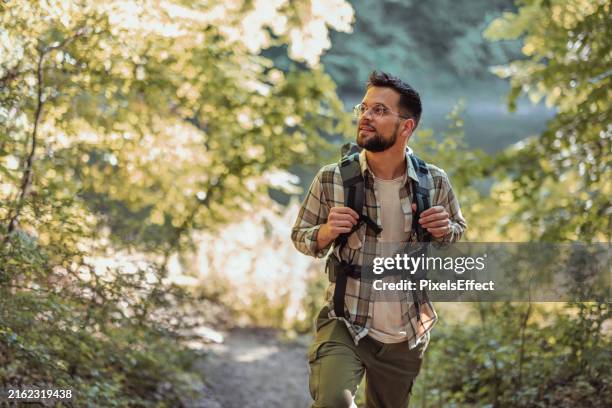 there's so much to see out there - male backpacker stock pictures, royalty-free photos & images