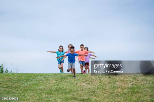 running into summer - arms outstretched stock pictures, royalty-free photos & images