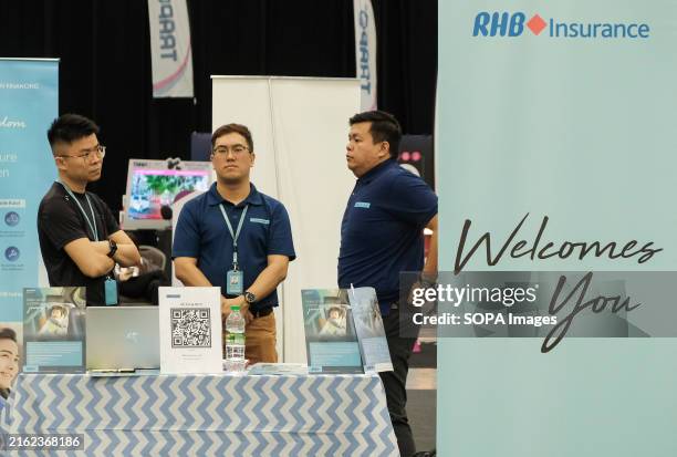 Promoters seen at RHB booth during the EvX expo at Setia Alam. EvX Electric Vehicle Expo is a premier consumer electric vehicle expo brought by...
