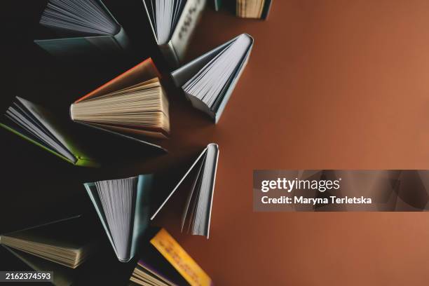 background with many books. different books in different sizes. school. education. online lessons. - literature stock pictures, royalty-free photos & images