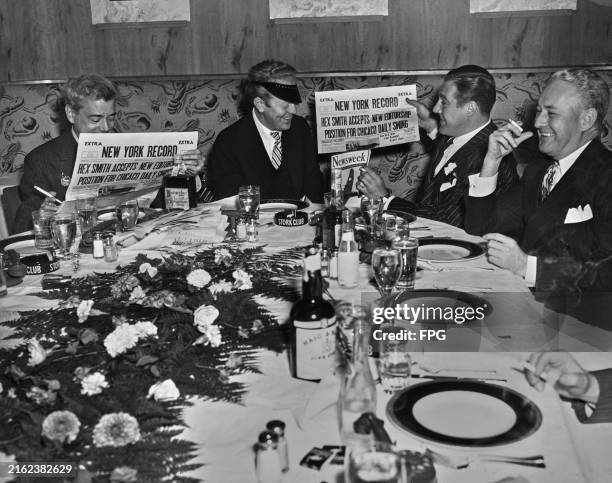 American magazine editor and drama critic George Jean Nathan, Rex Smith, wearing a visor, Paul Douglas and Robert Barry, with Nathan and Douglas...