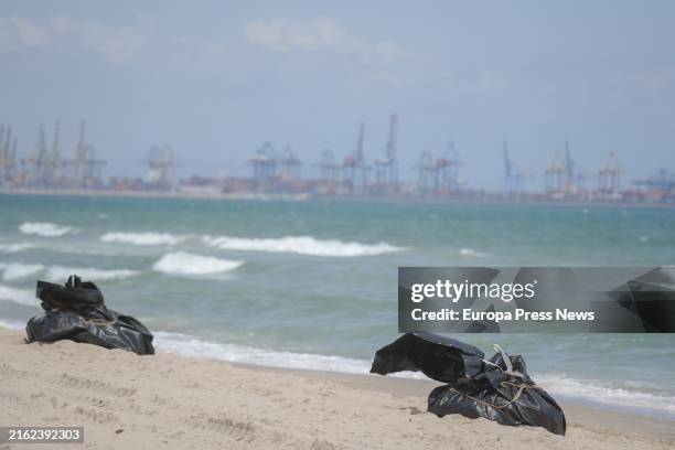 Garbage bags during the cleanup work on the Saler beach due to the spill, on 17 July, 2024 in Valencia, Valencian Community, Spain. The work of...
