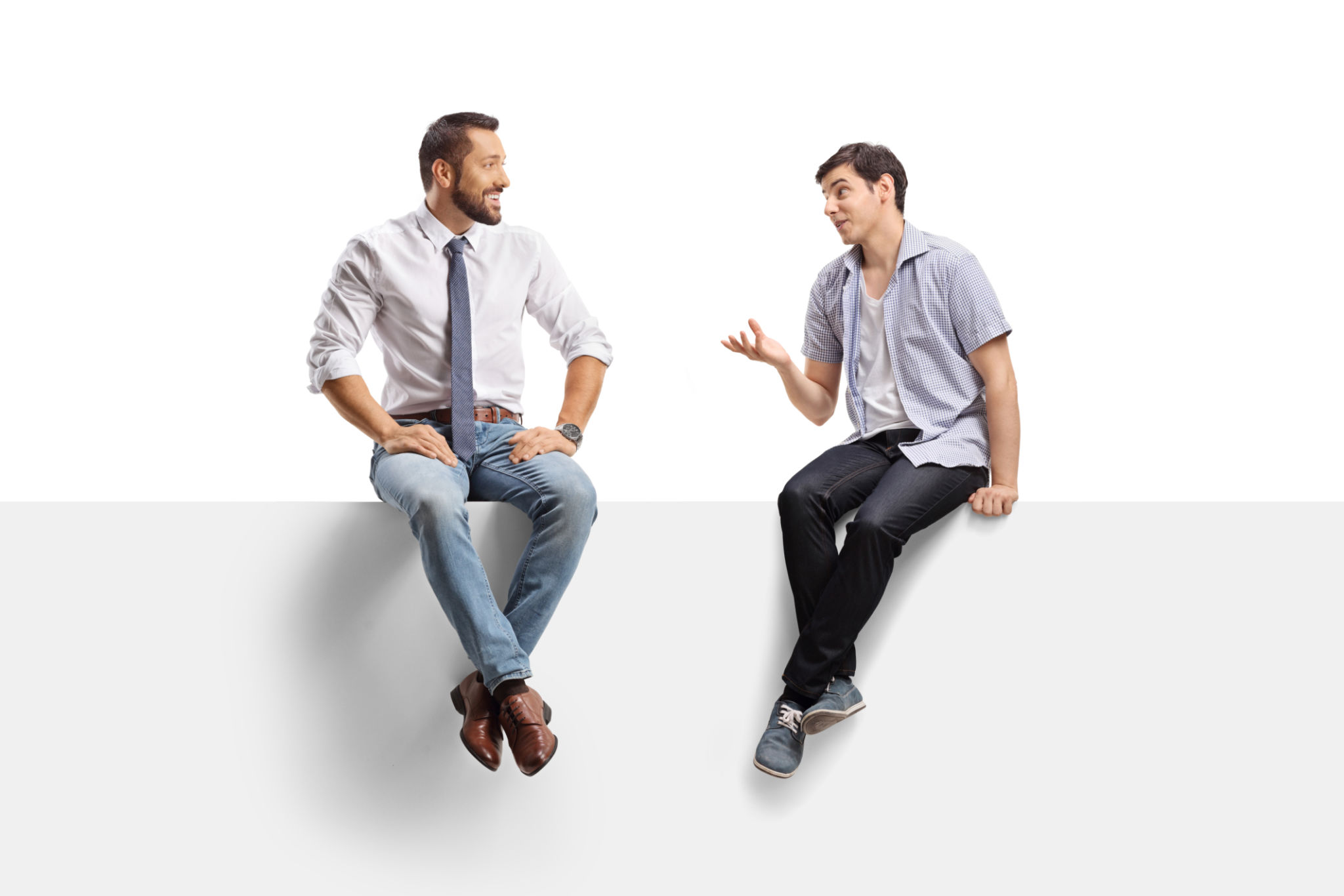 Two young men sitting on a panel and discussing Two young men sitting on a panel and discussing