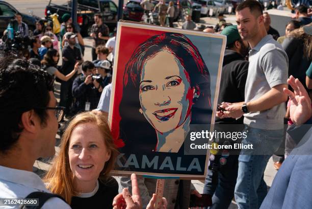 Supporter holds a sign as members of the San Francisco Democratic Party rally in support of Kamala Harris, following the announcement by US President...