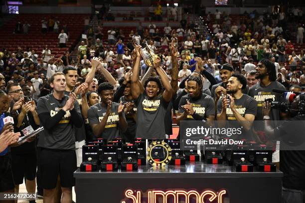 Miami Heat celebrate with the Summer League Championship Trophy after the game against the Memphis Grizzlies on July 22, 2024 at the Thomas & Mack...