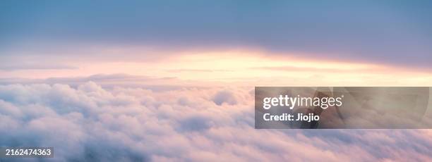 mid-air cloudscape against sunrise - blue morning glory stock pictures, royalty-free photos & images