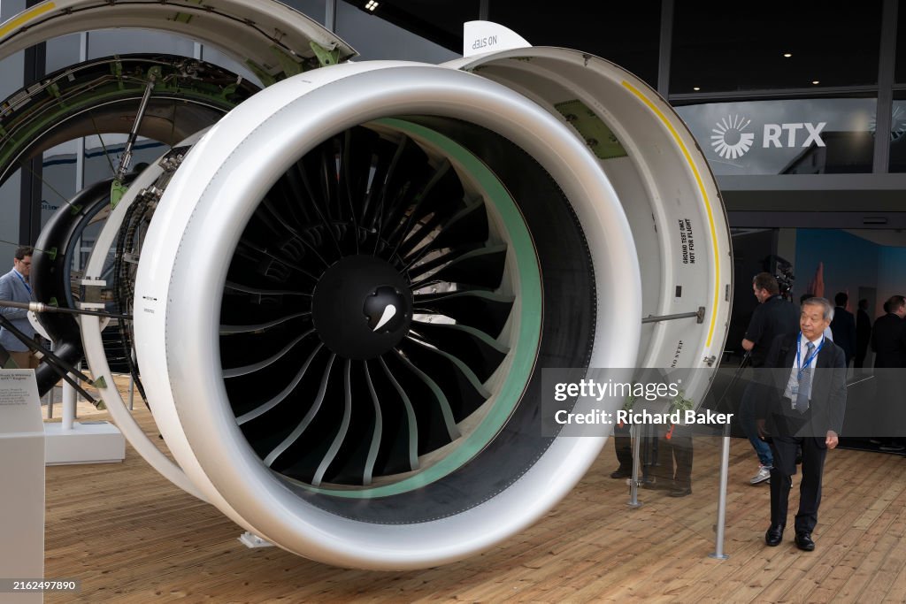Pratt Engine Jet Visitors inspect a Pratt & Whitney jet engine at the RTX exibition ...