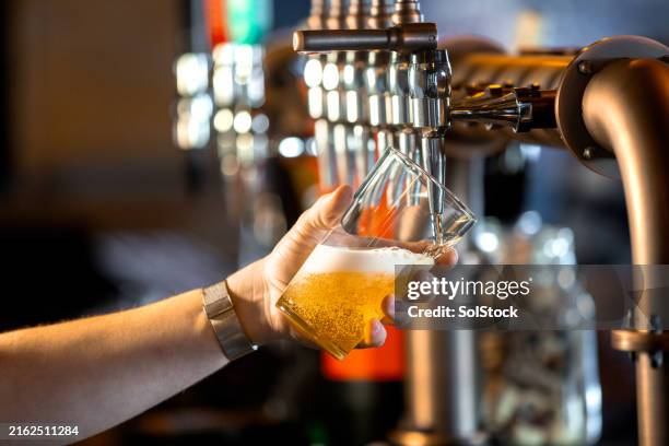 pouring a pint in a bar - empty stock pictures, royalty-free photos & images