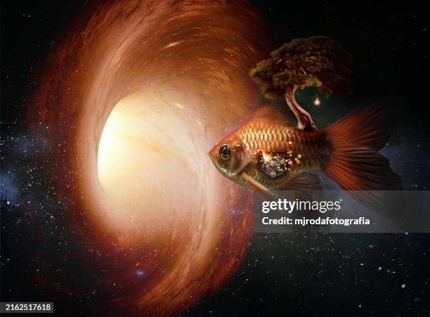 conceptual robotic fish with a tree and light bulb flying through outer space towards a black hole - glowing fish stock pictures, royalty-free photos & images