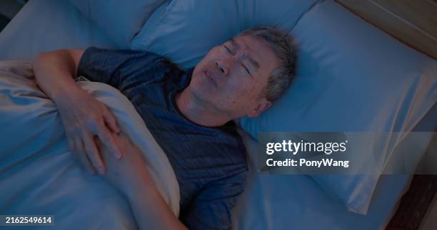 old man sleepless at night - uncomfortable stock pictures, royalty-free photos & images