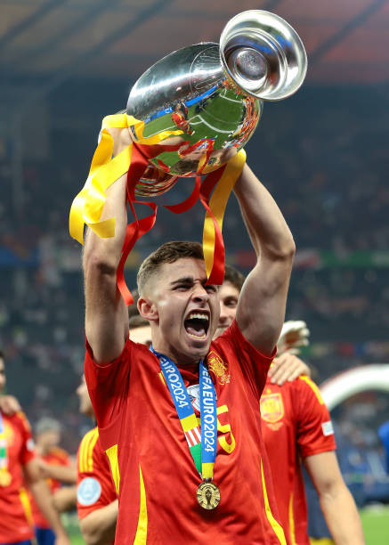 Fermin Lopez of Spain celebrates with the Henri Delaunay Cup following the 2-1 victory in the UEFA EURO 2024 final match between Spain and England at...