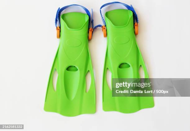 close-up of green bra on white background - schwimmflosse stock-fotos und bilder