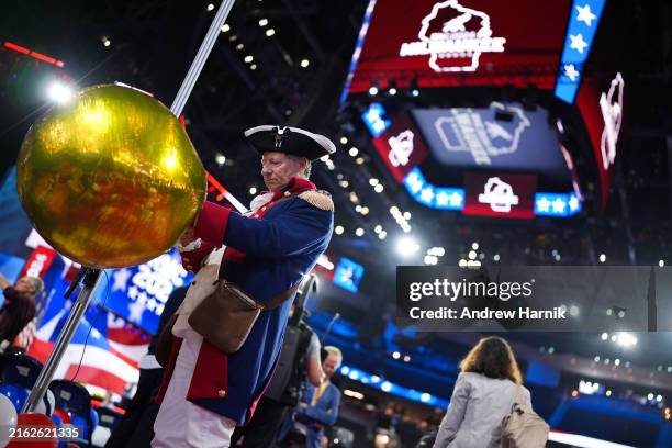 Attendees play with balloons after Republican presidential candidate, former U.S. President Donald Trump officially accepted the Republican...