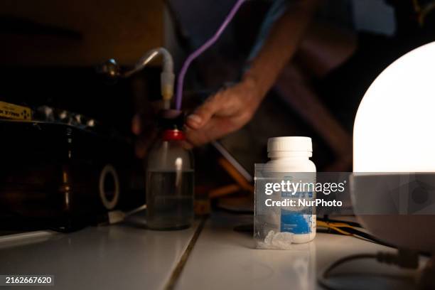 Someone is reaching for a crystal meth pipe next to a bottle of Dalavir, an antiretroviral medication used to treat HIV, before meeting someone for a...