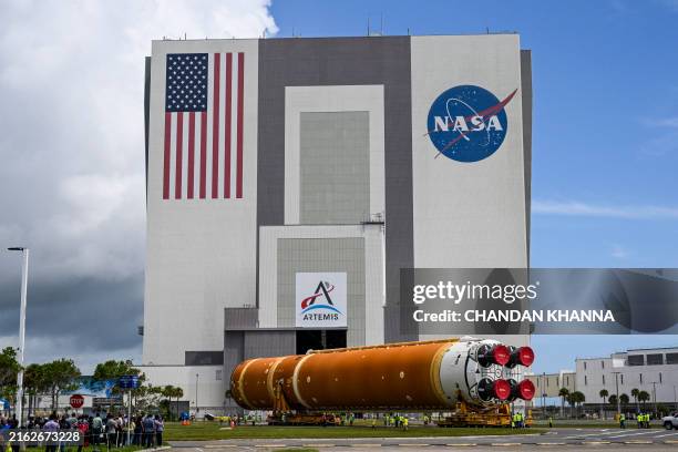 The Artemis II rocket core stage of NASA's Space Launch System is transported to the Vehicle Assembly Building at Kennedy Space Center in Florida, on...