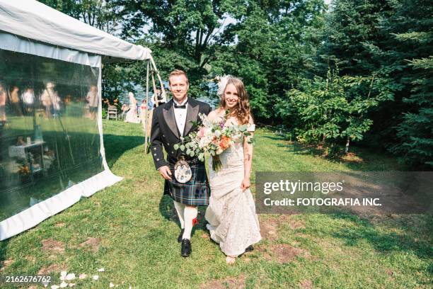 bride and groom after outdoor wedding ceremony - kilt stock pictures, royalty-free photos & images
