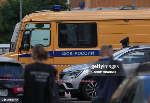 Investigative Committee of the Russian Federation teams conduct a large-scale investigation at the scene following an explosion on a parked car in...
