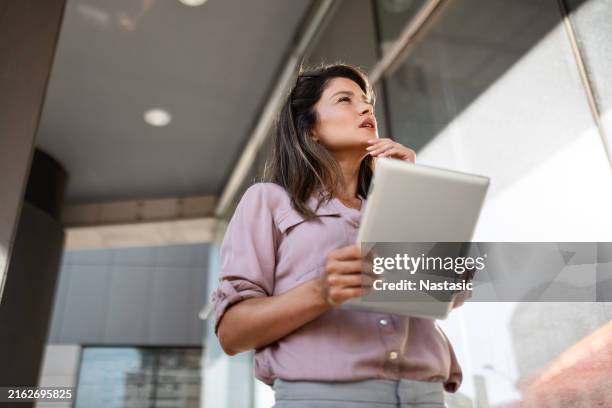 businesswoman with tablet outside - checkbox stock pictures, royalty-free photos & images
