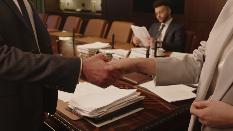 https://media.gettyimages.com/id/2162708578/video/two-unrecognisable-lawyers-shaking-hands-after-successful-meeting-in-boardroom.jpg?b=1&s=640x640&k=20&c=dY5wnJWZtxBsF2eGEzrO4Xr2OoVahbiECfueDqyroMQ=