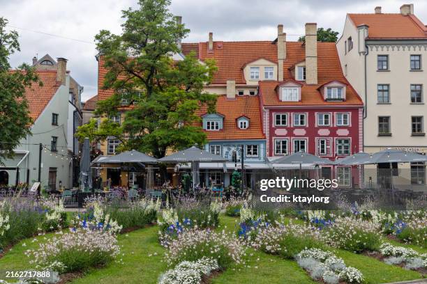 late afternoon on a summer day in livu square in old town riga - riga latvia stock pictures, royalty-free photos & images