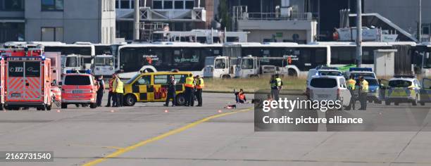 Dpatop - 25 July 2024, Hesse, Frankfurt/Main: Several demonstrators had forced their way onto the grounds of Frankfurt Airport in the early morning...