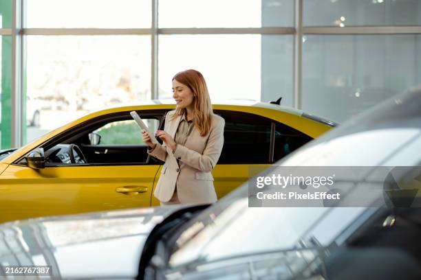 browsing through a catalogue of vehicles - rental car company stock pictures, royalty-free photos & images